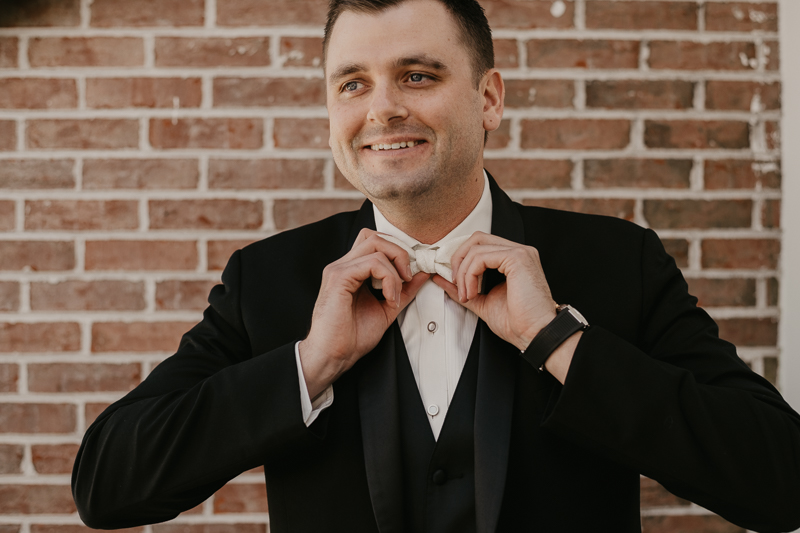 A groom getting ready for his wedding at The Hyatt Regency Chesapeake Bay, Maryland by Britney Clause Photography