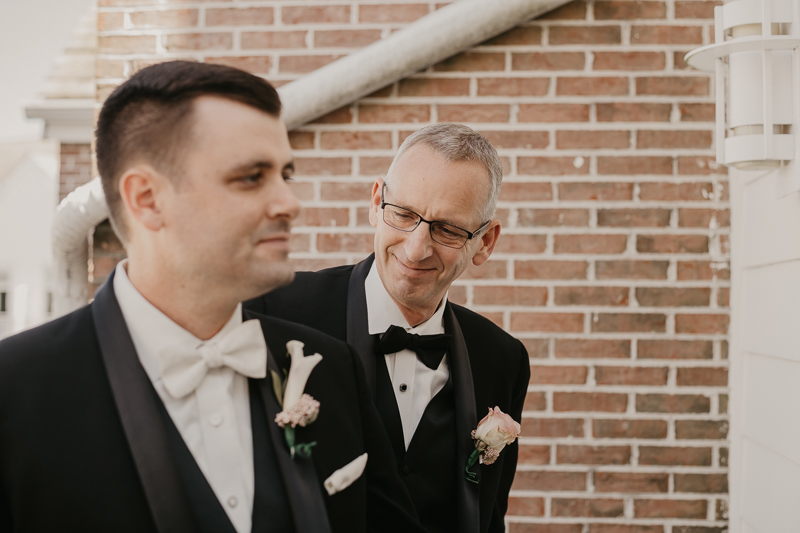 A groom getting ready for his wedding at The Hyatt Regency Chesapeake Bay, Maryland by Britney Clause Photography