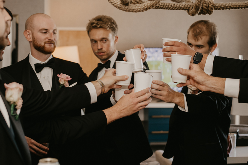 A groom getting ready for his wedding at The Hyatt Regency Chesapeake Bay, Maryland by Britney Clause Photography