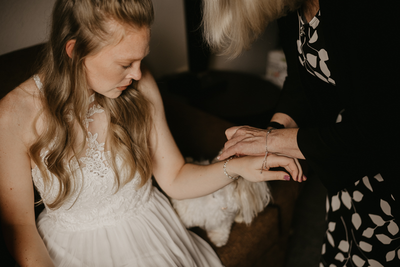 A bride getting ready for her wedding at the Vineyards of Mary's Meadow in Darlington, Maryland by Britney Clause Photography