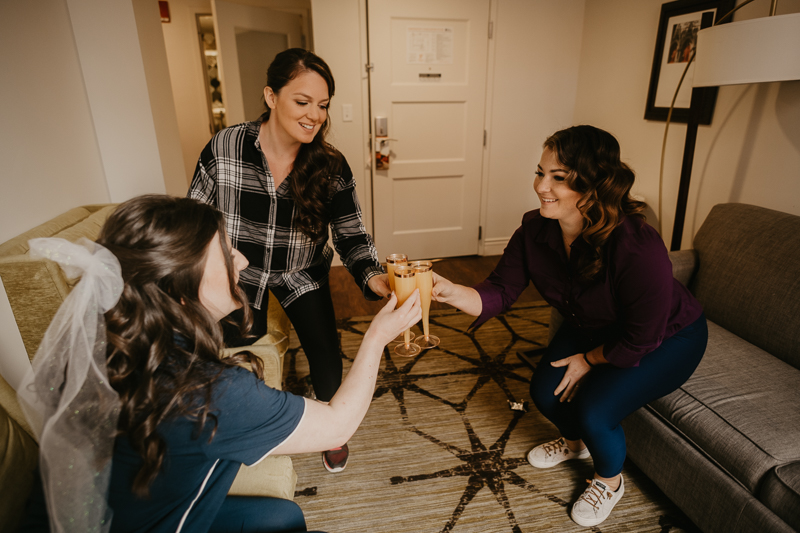 A bride getting ready at the Hotel Indigo for her Heron Room wedding in Baltimore, Maryland by Britney Clause Photography