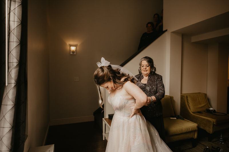 A bride getting ready at the Hotel Indigo for her Heron Room wedding in Baltimore, Maryland by Britney Clause Photography