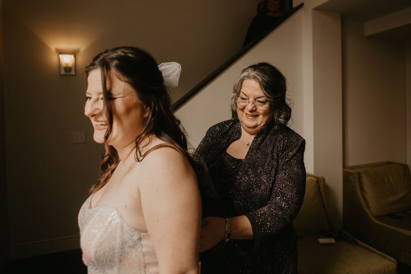 A bride getting ready at the Hotel Indigo for her Heron Room wedding in Baltimore, Maryland by Britney Clause Photography