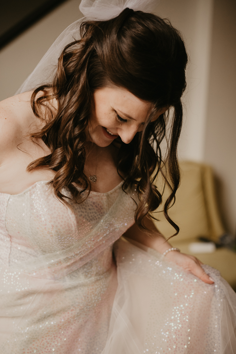 A bride getting ready at the Hotel Indigo for her Heron Room wedding in Baltimore, Maryland by Britney Clause Photography