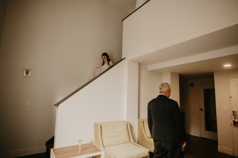 A bride getting ready at the Hotel Indigo for her Heron Room wedding in Baltimore, Maryland by Britney Clause Photography