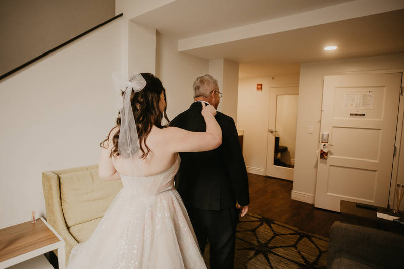 A bride getting ready at the Hotel Indigo for her Heron Room wedding in Baltimore, Maryland by Britney Clause Photography