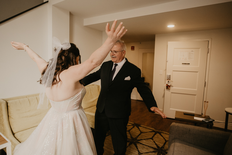 A bride getting ready at the Hotel Indigo for her Heron Room wedding in Baltimore, Maryland by Britney Clause Photography