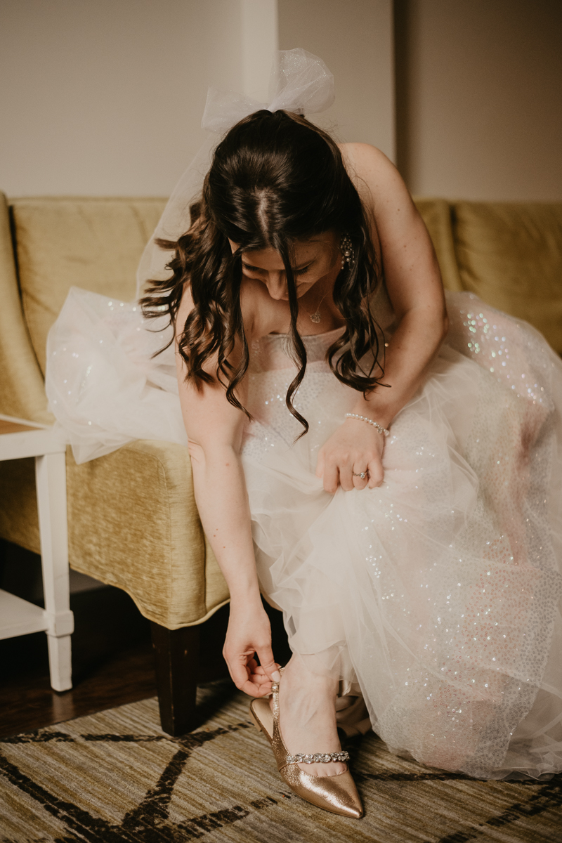 A bride getting ready at the Hotel Indigo for her Heron Room wedding in Baltimore, Maryland by Britney Clause Photography