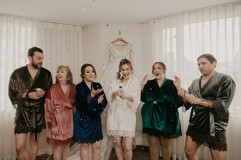 A bride getting ready at the Homewood Suites Hilton Hotel for a Mt. Washington Mill Dye House in Baltimore, Maryland by Britney Clause Photography