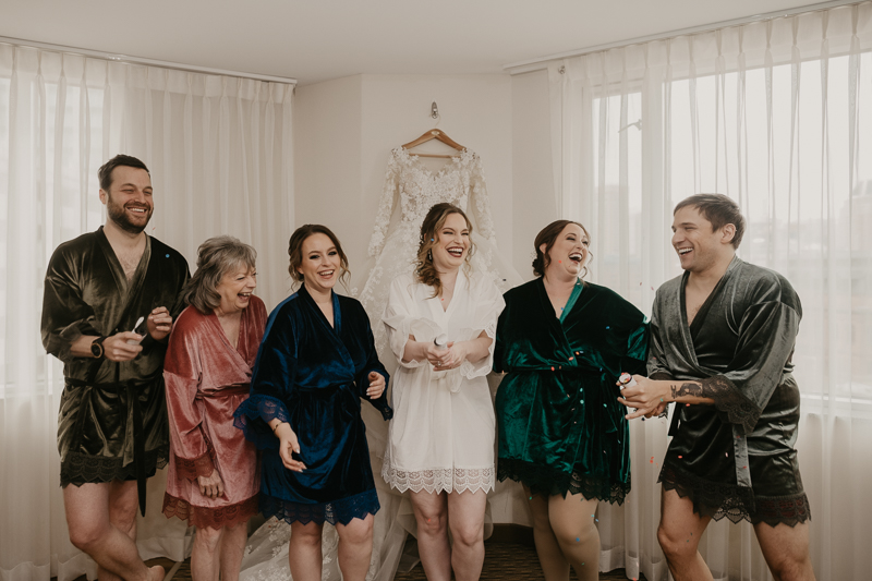 A bride getting ready at the Homewood Suites Hilton Hotel for a Mt. Washington Mill Dye House in Baltimore, Maryland by Britney Clause Photography