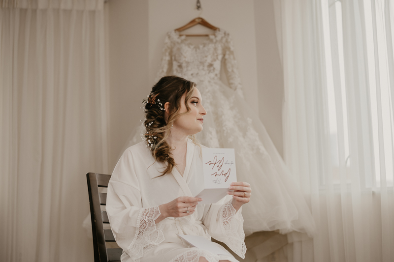 A bride getting ready at the Homewood Suites Hilton Hotel for a Mt. Washington Mill Dye House in Baltimore, Maryland by Britney Clause Photography