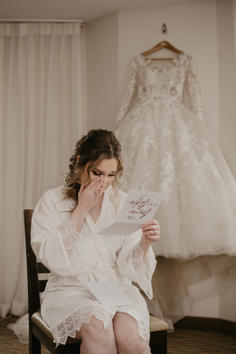 A bride getting ready at the Homewood Suites Hilton Hotel for a Mt. Washington Mill Dye House in Baltimore, Maryland by Britney Clause Photography