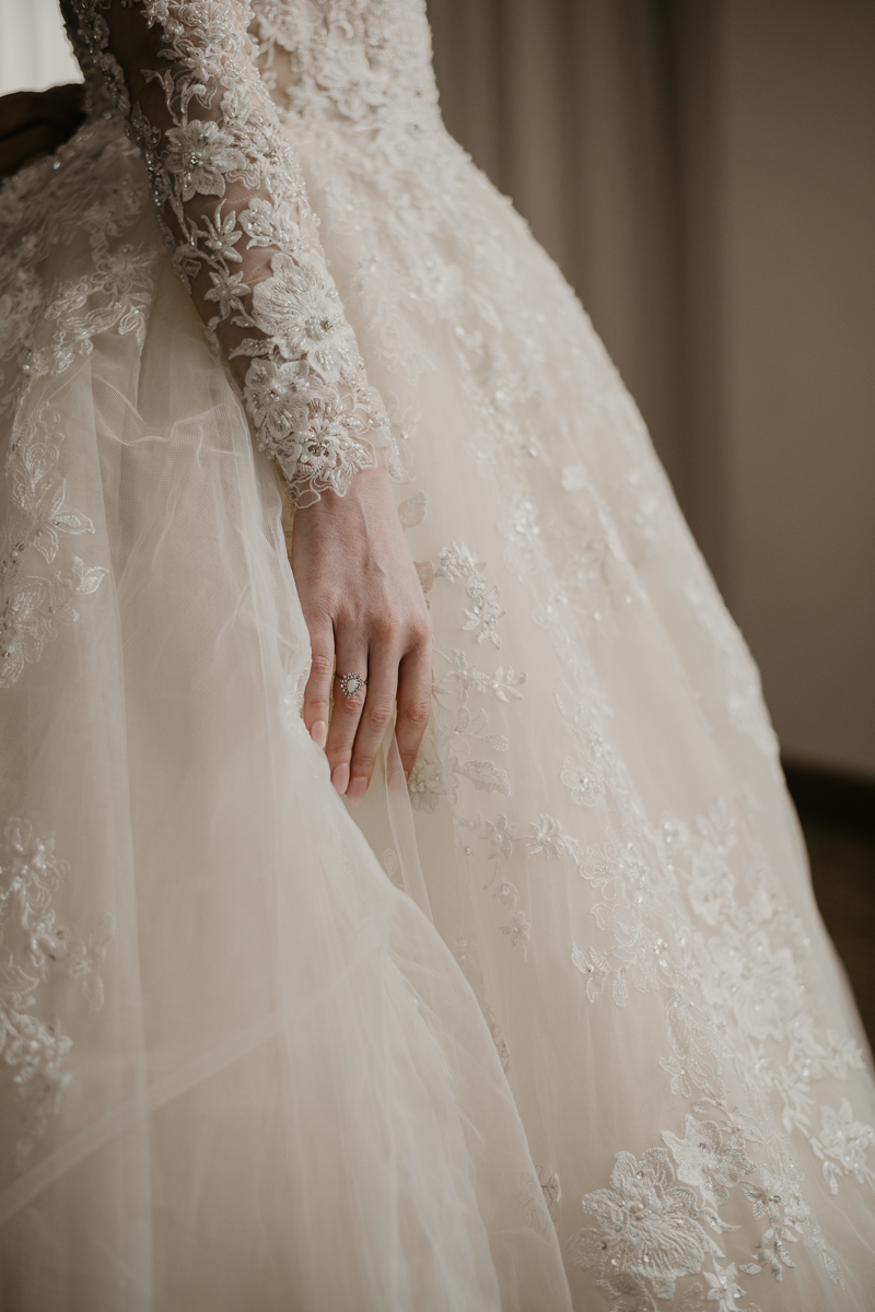 A bride getting ready at the Homewood Suites Hilton Hotel for a Mt. Washington Mill Dye House in Baltimore, Maryland by Britney Clause Photography