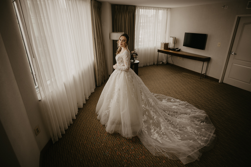 A bride getting ready at the Homewood Suites Hilton Hotel for a Mt. Washington Mill Dye House in Baltimore, Maryland by Britney Clause Photography