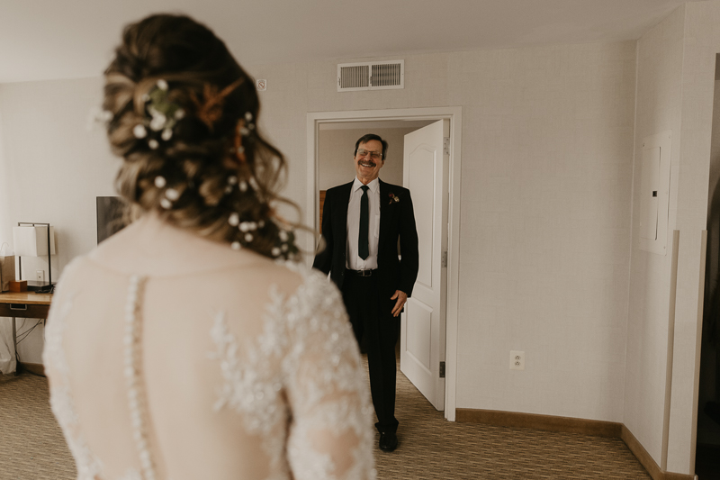 A bride getting ready at the Homewood Suites Hilton Hotel for a Mt. Washington Mill Dye House in Baltimore, Maryland by Britney Clause Photography