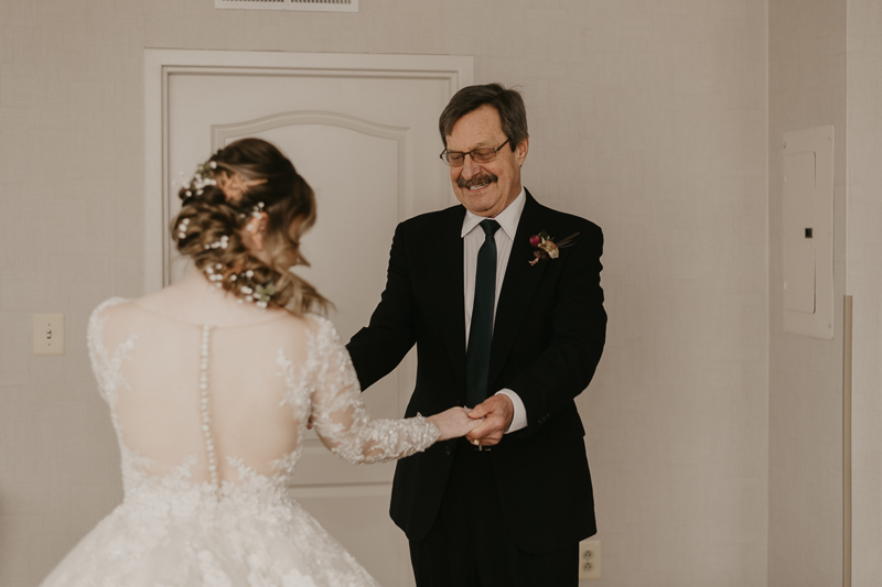 A bride getting ready at the Homewood Suites Hilton Hotel for a Mt. Washington Mill Dye House in Baltimore, Maryland by Britney Clause Photography