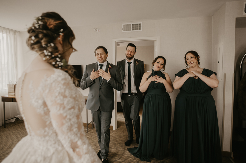 A bride getting ready at the Homewood Suites Hilton Hotel for a Mt. Washington Mill Dye House in Baltimore, Maryland by Britney Clause Photography