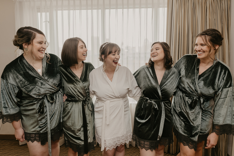 A bride getting ready at the Homewood Suites Hilton Hotel for a Mt. Washington Mill Dye House in Baltimore, Maryland by Britney Clause Photography