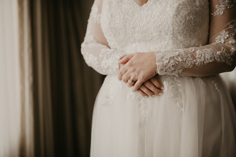 A bride getting ready at the Homewood Suites Hilton Hotel for a Mt. Washington Mill Dye House in Baltimore, Maryland by Britney Clause Photography