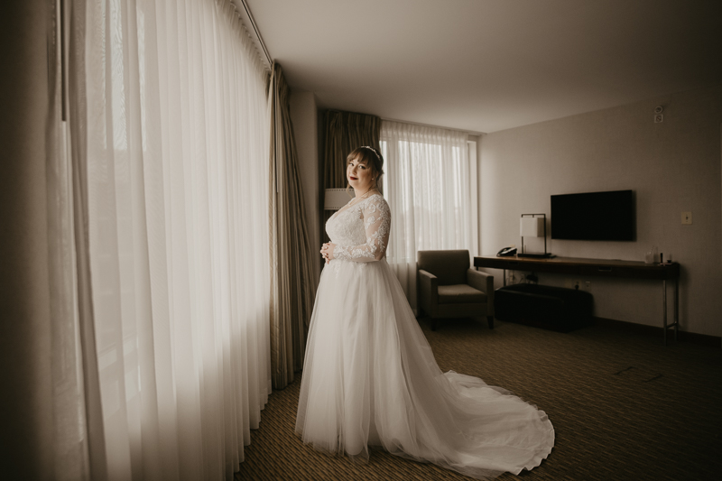 A bride getting ready at the Homewood Suites Hilton Hotel for a Mt. Washington Mill Dye House in Baltimore, Maryland by Britney Clause Photography