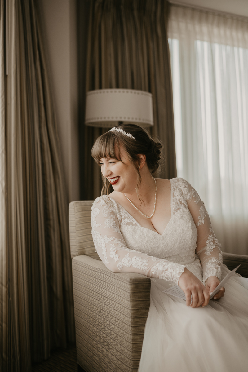 A bride getting ready at the Homewood Suites Hilton Hotel for a Mt. Washington Mill Dye House in Baltimore, Maryland by Britney Clause Photography