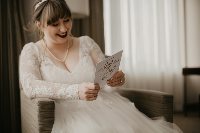 A bride getting ready at the Homewood Suites Hilton Hotel for a Mt. Washington Mill Dye House in Baltimore, Maryland by Britney Clause Photography