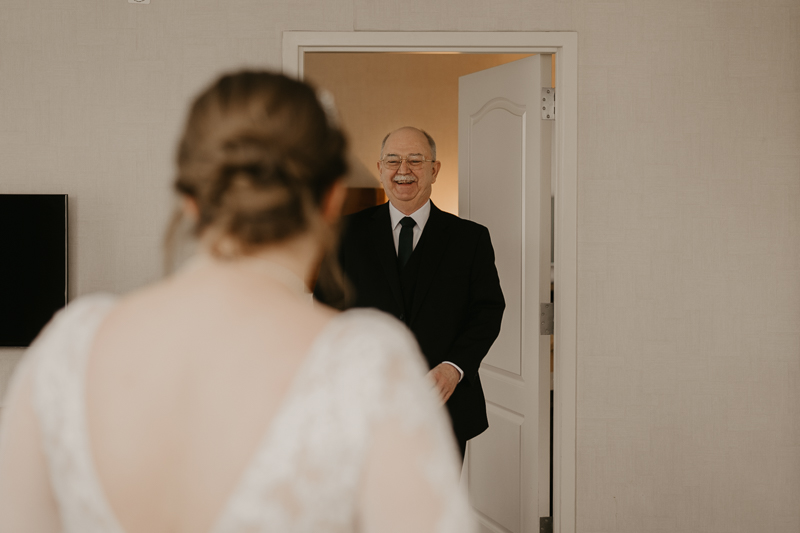 A bride getting ready at the Homewood Suites Hilton Hotel for a Mt. Washington Mill Dye House in Baltimore, Maryland by Britney Clause Photography