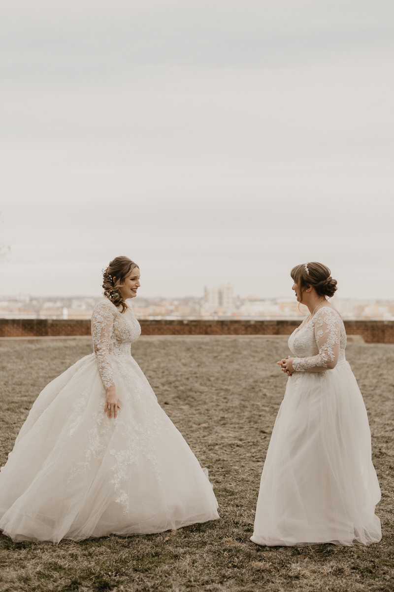 Stunning bride and bride wedding portraits at the Homewood Suites Hilton Hotel for a Mt. Washington Mill Dye House in Baltimore, Maryland by Britney Clause Photography