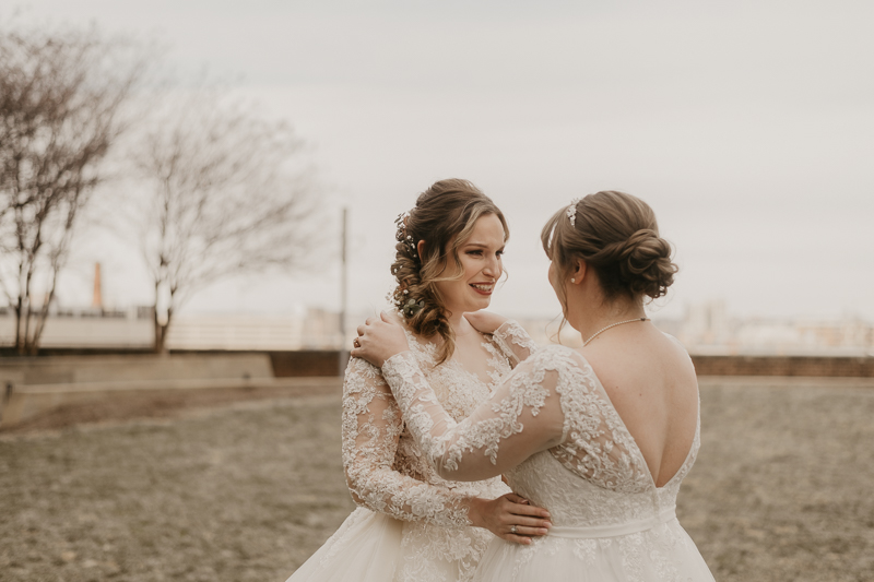 Stunning bride and bride wedding portraits at the Homewood Suites Hilton Hotel for a Mt. Washington Mill Dye House in Baltimore, Maryland by Britney Clause Photography