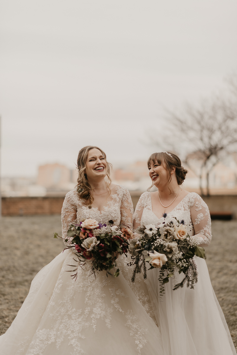 Stunning bride and bride wedding portraits at the Homewood Suites Hilton Hotel for a Mt. Washington Mill Dye House in Baltimore, Maryland by Britney Clause Photography