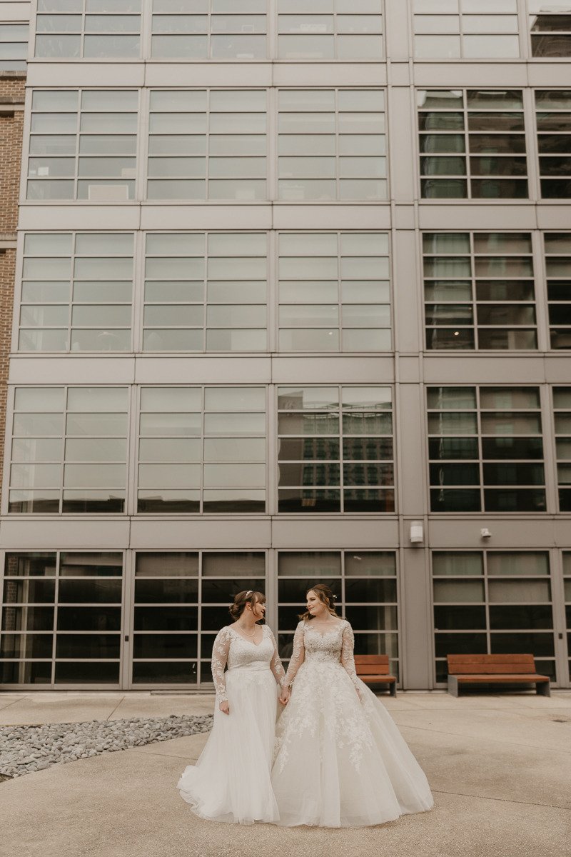 Stunning bride and bride wedding portraits at the Homewood Suites Hilton Hotel for a Mt. Washington Mill Dye House in Baltimore, Maryland by Britney Clause Photography