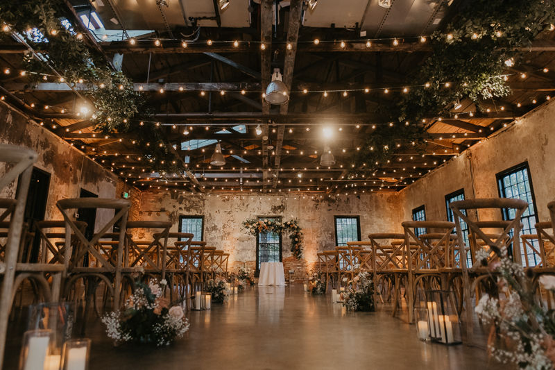 Amazing suspended wedding ceremony florals by Steel Cut Flower Co. at the Mt. Washington Mill Dye House in Baltimore, Maryland by Britney Clause Photography