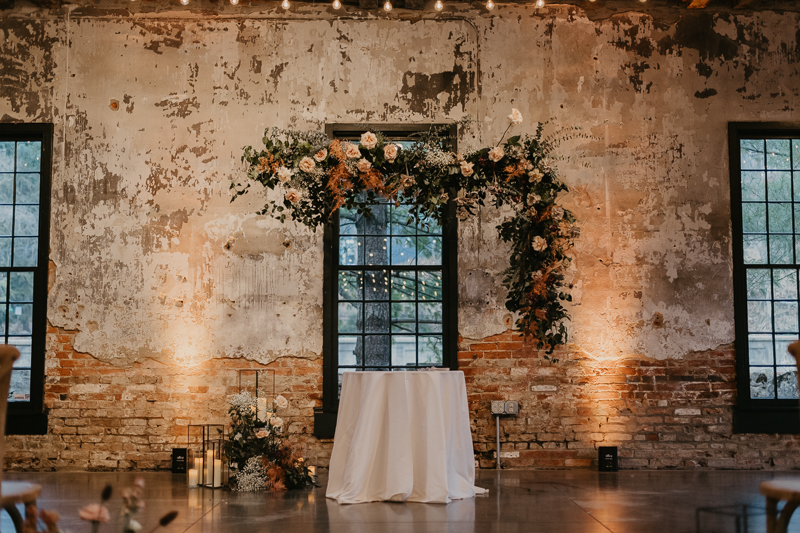 Amazing suspended wedding ceremony florals by Steel Cut Flower Co. at the Mt. Washington Mill Dye House in Baltimore, Maryland by Britney Clause Photography