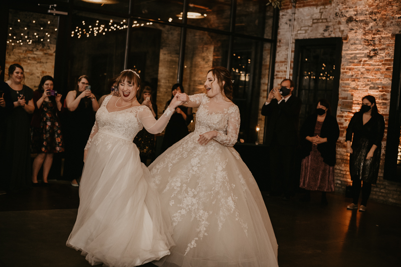 A bright and light filled evening wedding reception by District Remix DJs at the Mt. Washington Mill Dye House in Baltimore, Maryland by Britney Clause Photography