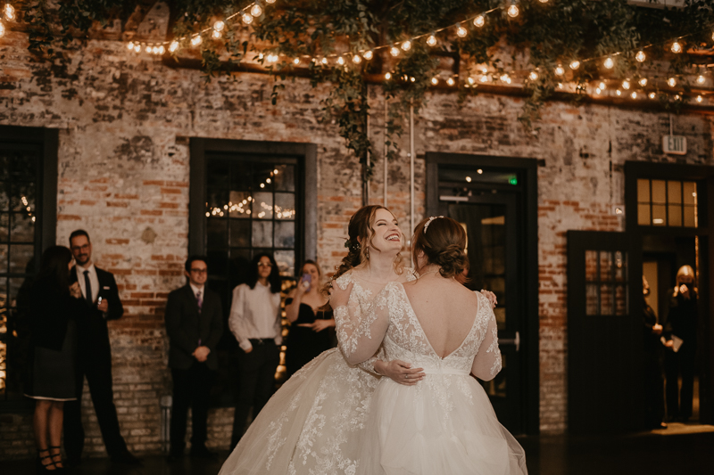 A bright and light filled evening wedding reception by District Remix DJs at the Mt. Washington Mill Dye House in Baltimore, Maryland by Britney Clause Photography