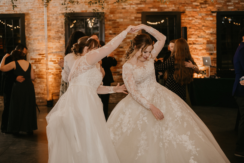 A bright and light filled evening wedding reception by District Remix DJs at the Mt. Washington Mill Dye House in Baltimore, Maryland by Britney Clause Photography