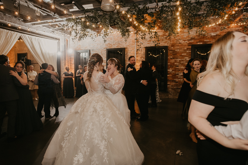 A bright and light filled evening wedding reception by District Remix DJs at the Mt. Washington Mill Dye House in Baltimore, Maryland by Britney Clause Photography