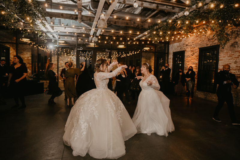 A bright and light filled evening wedding reception by District Remix DJs at the Mt. Washington Mill Dye House in Baltimore, Maryland by Britney Clause Photography