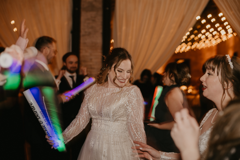 A bright and light filled evening wedding reception by District Remix DJs at the Mt. Washington Mill Dye House in Baltimore, Maryland by Britney Clause Photography