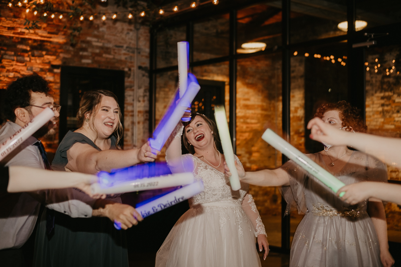 A bright and light filled evening wedding reception by District Remix DJs at the Mt. Washington Mill Dye House in Baltimore, Maryland by Britney Clause Photography