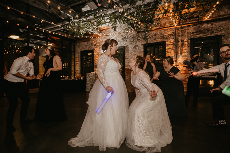 A bright and light filled evening wedding reception by District Remix DJs at the Mt. Washington Mill Dye House in Baltimore, Maryland by Britney Clause Photography