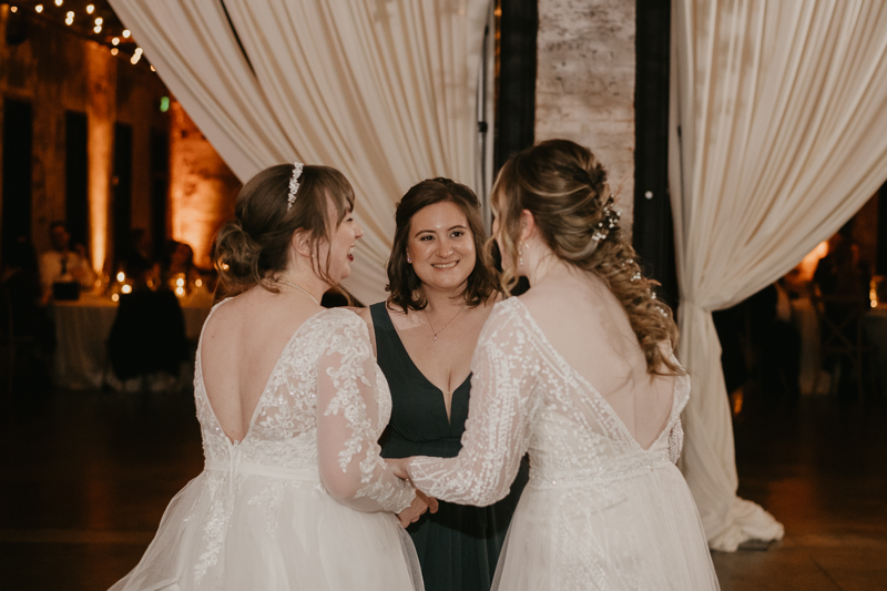 A bright and light filled evening wedding reception by District Remix DJs at the Mt. Washington Mill Dye House in Baltimore, Maryland by Britney Clause Photography