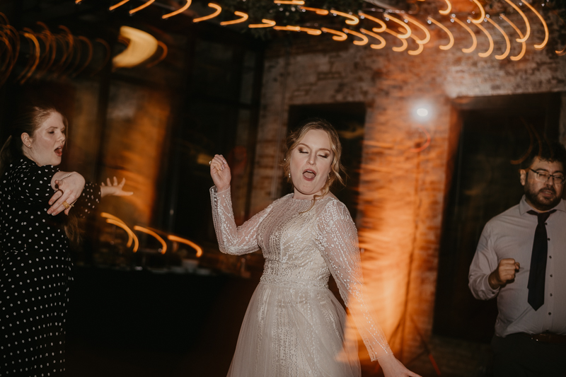 A bright and light filled evening wedding reception by District Remix DJs at the Mt. Washington Mill Dye House in Baltimore, Maryland by Britney Clause Photography