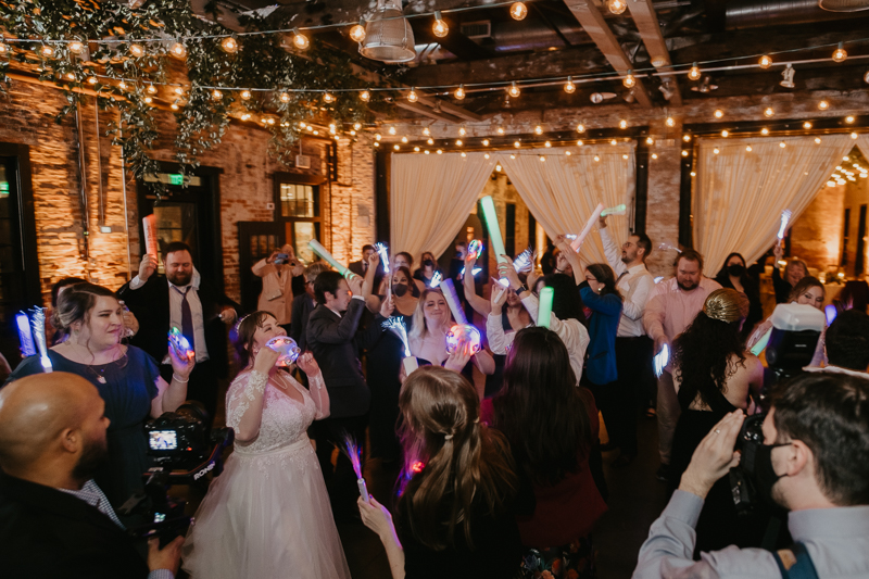 A bright and light filled evening wedding reception by District Remix DJs at the Mt. Washington Mill Dye House in Baltimore, Maryland by Britney Clause Photography