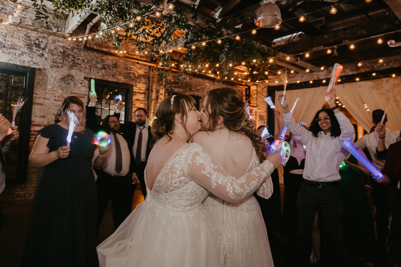 A bright and light filled evening wedding reception by District Remix DJs at the Mt. Washington Mill Dye House in Baltimore, Maryland by Britney Clause Photography