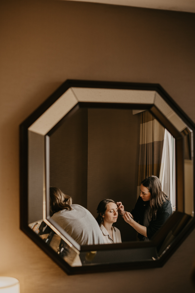 A bride getting ready at the Sheraton Baltimore North Hotel for a Mt. Washington Mill Dye House in Baltimore, Maryland by Britney Clause Photography