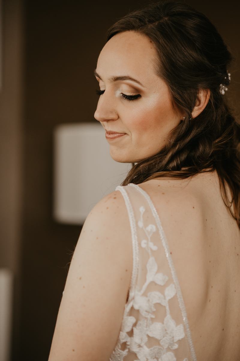 A bride getting ready at the Sheraton Baltimore North Hotel for a Mt. Washington Mill Dye House in Baltimore, Maryland by Britney Clause Photography