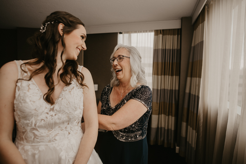 A bride getting ready at the Sheraton Baltimore North Hotel for a Mt. Washington Mill Dye House in Baltimore, Maryland by Britney Clause Photography