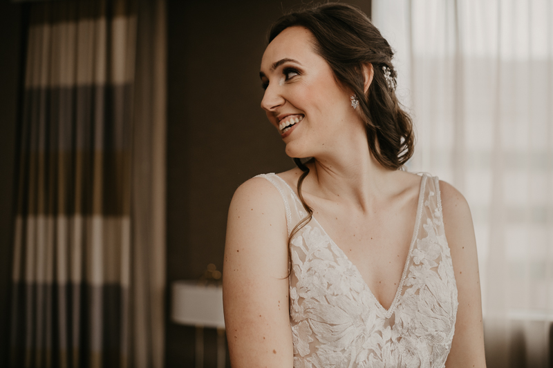 A bride getting ready at the Sheraton Baltimore North Hotel for a Mt. Washington Mill Dye House in Baltimore, Maryland by Britney Clause Photography