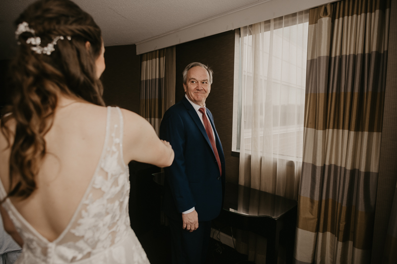 A bride getting ready at the Sheraton Baltimore North Hotel for a Mt. Washington Mill Dye House in Baltimore, Maryland by Britney Clause Photography
